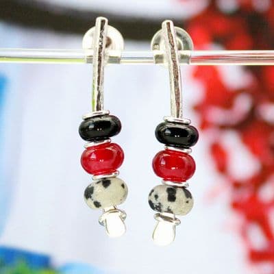 Handmade sterling silver earrings featuring black onyx, chalcedony and jasper. Small arc earrings.