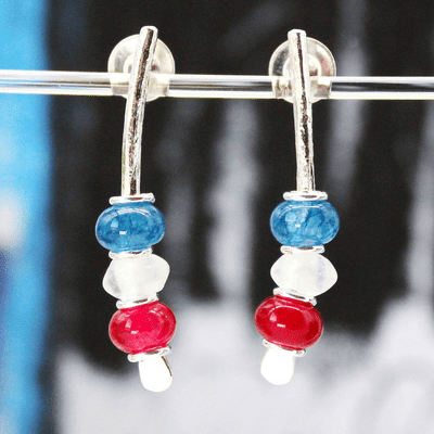 Handmade sterling silver earrings, featuring blue, clear and red gemstones. Small arc earrings.