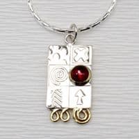 Handmade sterling silver pendant with a garnet gemstone and silver chain.  M. Gemstone choice.