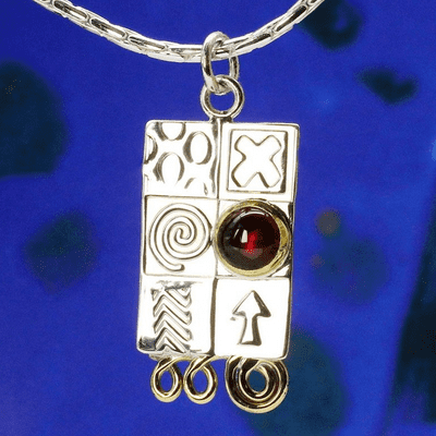 Handmade sterling silver pendant with a garnet gemstone and silver chain.  M. Gemstone choice.