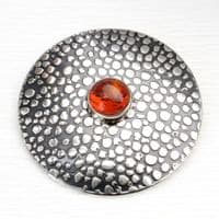 Handmade sterling silver Shagreen pattern brooch featuring a 10mm Amber stone