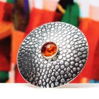 Handmade sterling silver Shagreen pattern brooch featuring a 10mm Amber stone