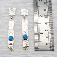 Handmade sterling silver stud drop earrings featuring two beautiful blue opal triplets. M.