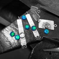 Handmade sterling silver stud drop earrings featuring two beautiful blue opal triplets. M.