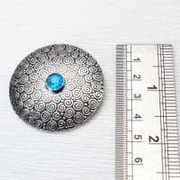 Handmade sterling silver Swirl pattern brooch featuring a beautiful 8mm blue Opal gemstone