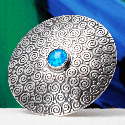 Handmade sterling silver Swirl pattern brooch featuring a beautiful 8mm blue Opal gemstone