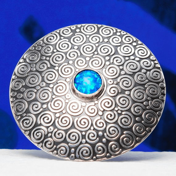 Handmade sterling silver Swirl pattern brooch featuring a beautiful 8mm blue Opal gemstone
