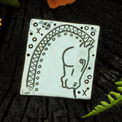 Horse brooch, polished silver