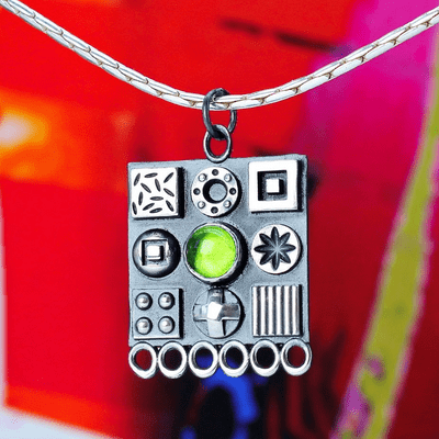 Large square oxidised solid sterling silver pendant with polished 3D symbols and a Peridot gemstone