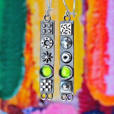 Long solid sterling silver oxidised earrings with 3D symbols and Peridot gemstones
