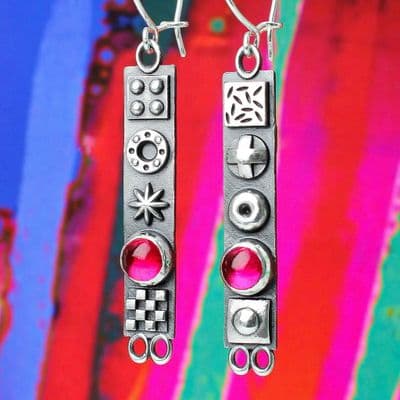 Long solid sterling silver oxidised earrings with 3D symbols and Pink corundum gemstones