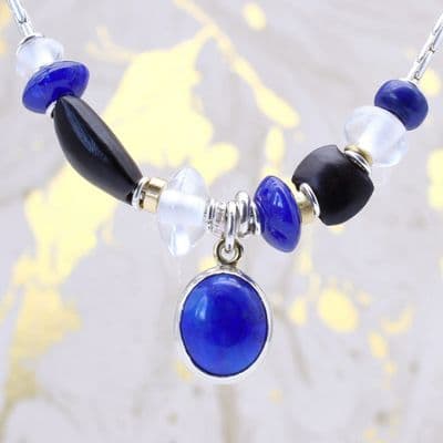 One of a kind, unique Lapis lazuli necklace with hand carved wooded beads.