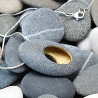 Pebble pendant with sterling silver chain, 'Hollow'