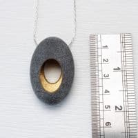 Pebble pendant with sterling silver chain, 'Hollow'