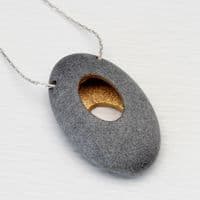 Pebble pendant with sterling silver chain, 'Hollow'