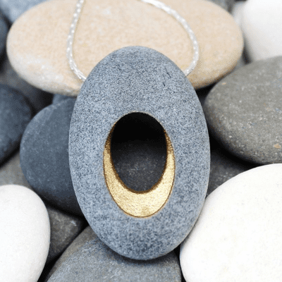 Pebble pendant with sterling silver chain, 'Hollow'