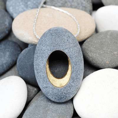 Pebble pendant with sterling silver chain, 'Hollow'