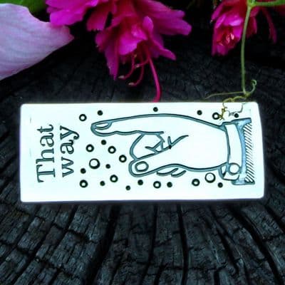 Pointing finger brooch, letterpress, block print, polished silver