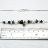 Star pearl necklace featuring freshwater pearls and a hand-carved wooden bead