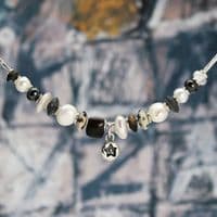 Star pearl necklace featuring freshwater pearls and a hand-carved wooden bead