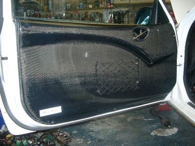 MG ZR GRP/Carbon Door Card L/H. RT0555/ZI