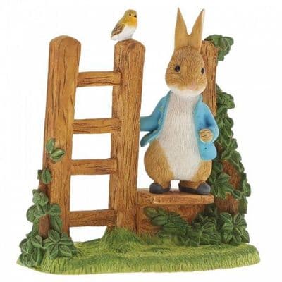 Peter Rabbit on a wooden stile figurine. A29835