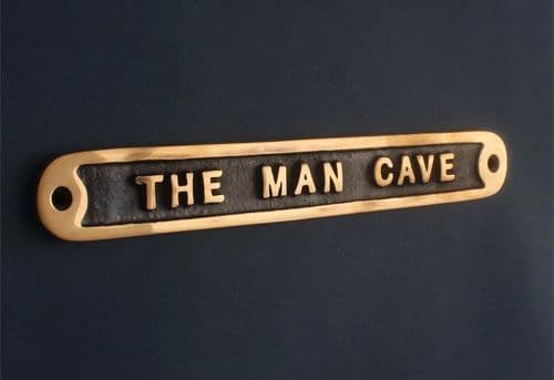 BRASS MAN CAVE SIGN