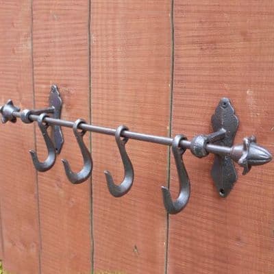 Four Metal Hooks on Bar