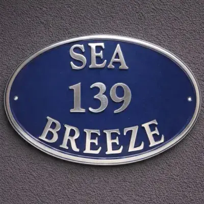 Oval Shape Cast Aluminium Sign - Polished Curved Text