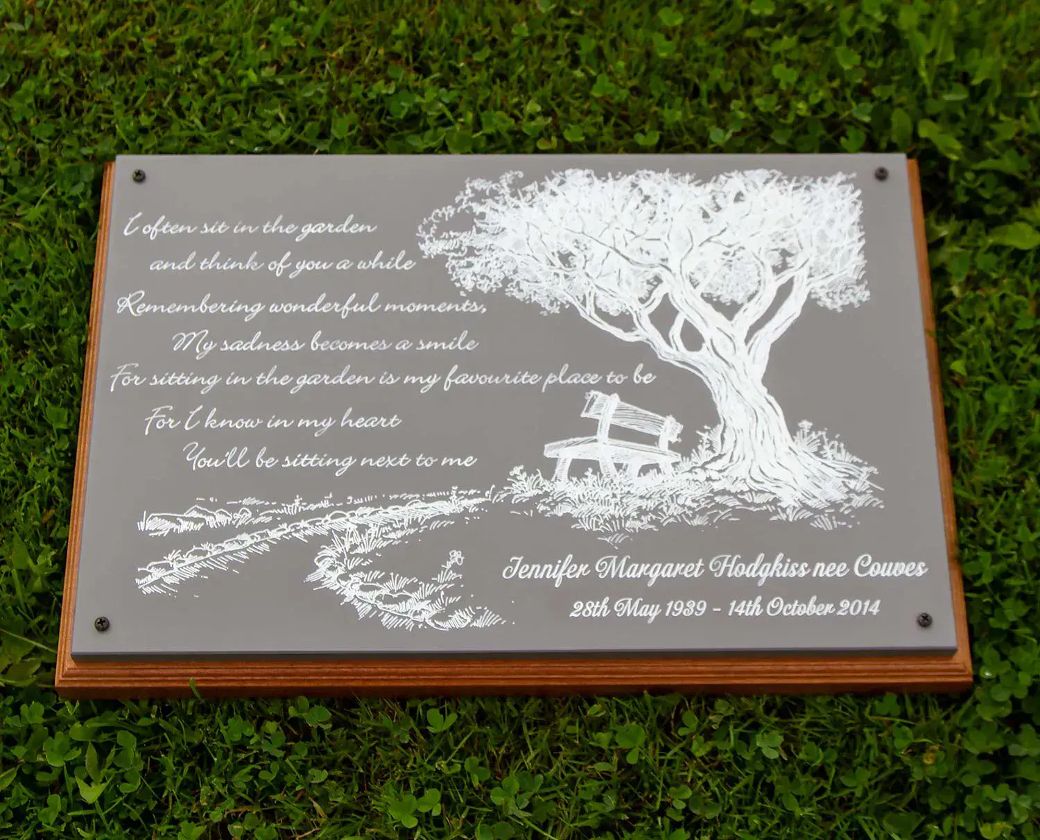 Beautiful engraved plaque on a backing board.