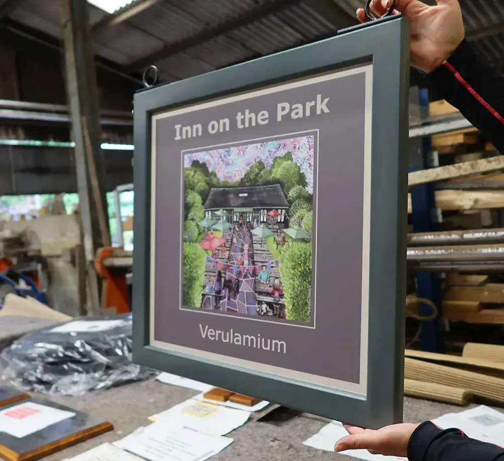 Painted framed double sided sign