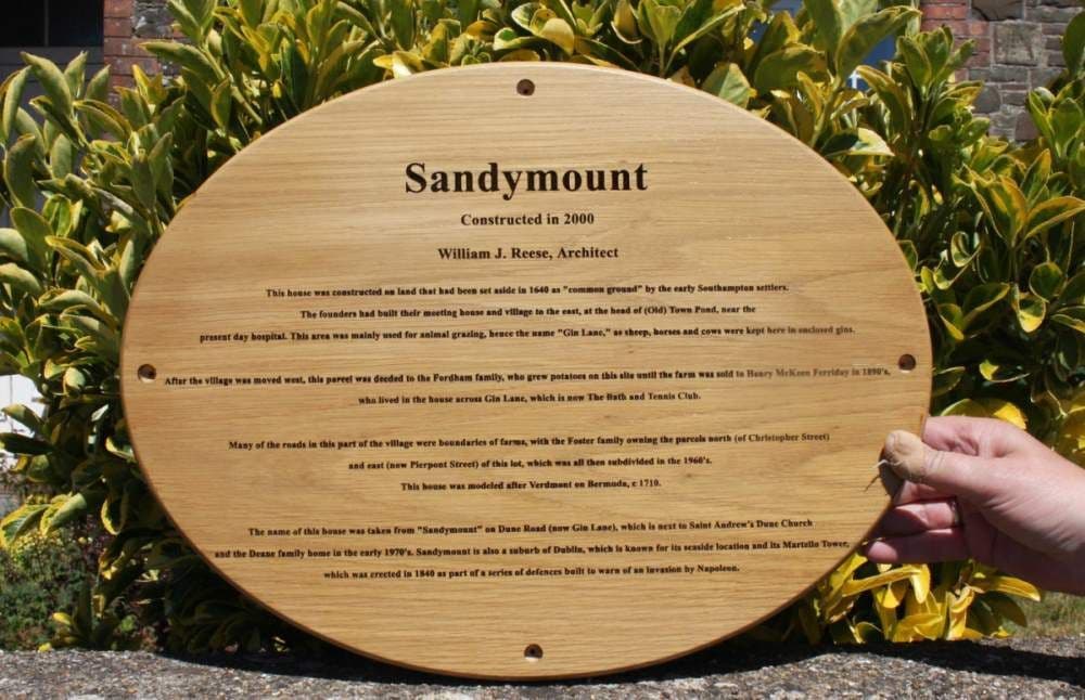 Oval oak sign with very small text