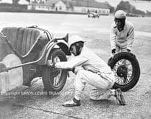 Austin 7 TT Model. Photo. Hon Victoria Worsley and RSL Boote change tyres(Photo A)