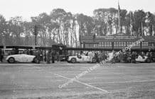 Auto Union C Type V16 Muller, Donington GP 1937 pits with Mercedes (von Brautsitsch)