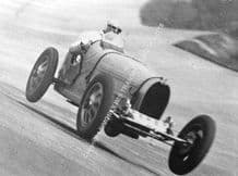 Bugatti T51 G E T Eyston air-bourne at Brooklands. Photo