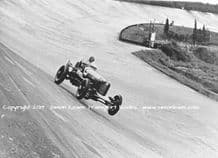DUESENBERG Indianapolis Car.Photo. Whitney Straight at speed, Brooklands 1934