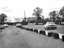 FORD GALAXIE Jack Sears, Wilment car leads Jaguars. Suilverstone 1963