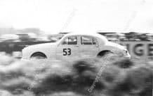 Jaguar Mk1 Roy Salvadori in John Coombes entered car. Silverstone 1959