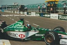 JAGUAR R1 F1 Dario Franchitti exits pit garage, testing at Silverstone 2000 . Photo