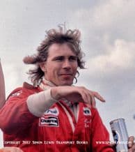 James Hunt (with beer can...) photo.  On his Lap Of Honour after winning British GP 1977