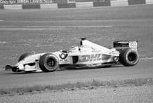 Jordan EJ11 Sato at speed, Silverstone 2002 (a)