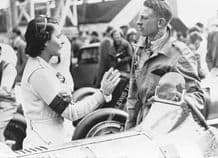 Kay Petre in Brooklands paddock beside her car (Riley ?) JCC International Trophy Maybe 1938