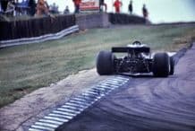 Lotus 78 Mario Andretti at speed tail view 77 Brit GP
