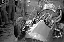 Maserati 250F mechanic Alf Francis in Moss's car. Oulton Park paddock 1954 Gold Cup