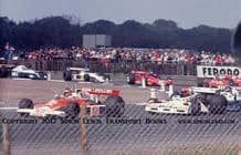 McLaren M23. Photo.Gilles Villeneuve (on his GP Debut)Leads Barmbilla, Peterson etc. 1977 British GP