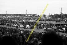 Mercedes 300SLRs and Jaguar D Types at Le Mans prior to start 1955