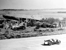MG at Brooklands with crashed RAF Plane trackside. Unknown date and driver.