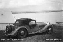 Morgan Plus 4 beside a tent maybe early 60s.