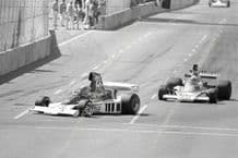 Parnelli VPJ4/2 F1 Mario Andretti leads Mass (McLaren) 1976 Long Beach GP action photo