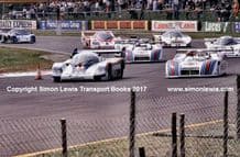 Porsche 956 (Ickx) & Lanica LCI (Ghinzani)leads rolling start at speed Silverstone 6 Hours Group C 1982